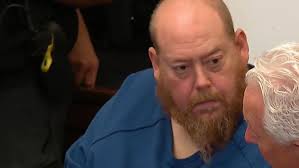 Man accused of killing deputy pleads not guilty to 14 counts, bond raised  to $9M