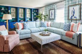 A pretty living room with a turquoise sofa, a modern storage unit, a coffee table and touches of gold here and there. 40 Living Family Rooms With Oversized Sofas Sectionals Chairish Blog