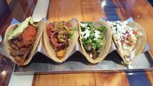 Lay in the unpeeled garlic cloves and chiles. Road Tips Mission Taco Joint St Louis