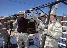 CPT Joe Pullen, Administrative Officer, and MSGT Perry Cline, Services  SPECIALIST, and others assigned to the 225th Combat Communications  Squadron, Martin Air National Guard Station, Gadson, Alabama, set up the  framework for