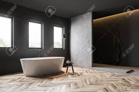 You can either decide . Corner Of Dark Gray Bathroom With Wooden Floor Comfortable White Stock Photo Picture And Royalty Free Image Image 124086306