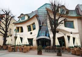 Poland is an amazing destination with stunning architecture and fascinating history packed into every city and town. Krzywy Domek Crooked House In Sopot Poland Idesignarch Interior Design Architecture Interior Decorating Emagazine Crooked House Unusual Buildings Houses In Poland