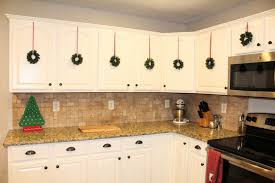 Festive Holiday Kitchen Cabinet Wreaths Diy Project Holiday Kitchen Kitchen Cabinets Diy Wreath
