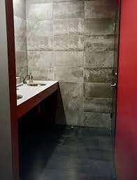Forge delivers the worn and weathered artistry of metal recreated with a style that delivers a strong, urban personality. O Xrhsths Atlas Concorde Usa Sto Twitter This Commercial Bathroom Features Two Colors From The Forge Collection The Worn Metal Effect Immediately Gives This Space A Modern And Industrial Vibe Forge Steel