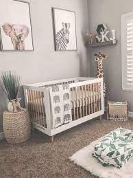 Gender Neutral Boho Safari Jungle Nursery With Giraffe Plush And Elephant Baby Blanket Nurseryidea Baby Boy Room Nursery Nursery Baby Room Baby Safari Nursery