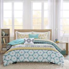 Create a southwestern style atmosphere in your bedroom with these tribal inspired printed patterns complemented by warm earth tone color hues. Intelligent Design Arissa Comforter Set Twin Twin Xl Size Teal Yellow Tribal Comforters Sets Home Garden