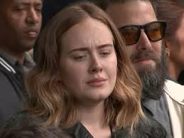 Adele joins mourners singing 'Lean