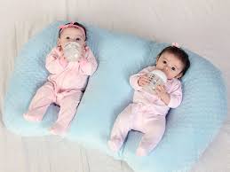 Best Products For Parents Of Twins And Multiples Babycenter Breastfeeding Pillow Twin Baby Gifts Twin Babies