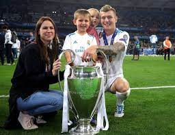 Toni kroos is a german professional footballer who plays as a midfielder for the german national team as well as the spanish club, real madrid. Toni Kroos Of Real Madrid And His Family Pose With The Trophy After The Uefa Champions League Final Between Real Toni Kroos Real Madrid Real Madrid Wallpapers