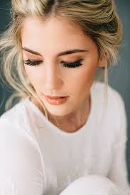 Romantic Tousled Bridal Braid Adorned With Baby S Breath Mon Cheri Bridals My Blog Wedding Makeup For Brown Eyes Best Wedding Makeup Amazing Wedding Makeup
