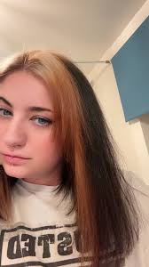 Where can I get my black hair stripped to achieve silver hair?