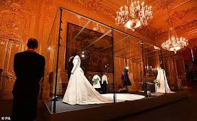 The dress features a neckline that folds around the shoulders to a low back that drapes into a flowing full length train. Windsor Castle Announces New Exhibition Featuring Princess Eugenie S Peter Pilotto Wedding Dress Daily Mail Online