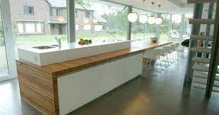 keukeninspiratie voor een moderne open keuken met keukeneiland kookeiland en inbouwkasten vervaardigd in solid surf keuken ontwerpen keukeneiland keukentafel