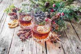 Get christmas cocktail recipes for punches, sangrias, and other mixed drinks for the holidays. Christmas Winter Alcohol Drink Orange Spice And Bourbon Whiskey Alcoholic Cocktail In Two Glasses Wooden Background With Christmas Tree Branches And Decor Copy Space Stock Photo Picture And Royalty Free Image Image