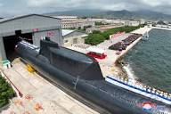 North Korea unveils first tactical, nuclear-armed submarine | Reuters