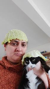 Jealous of my cat not having to pluck her hairy chin. I've decided to stop  and play cabbage hats with her instead.