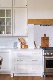 Lots of color in one kitchen with white cabinetry and countertops! 70 White Cabinets With White Countertop Going Out Of Style