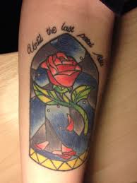 This vibrant stained glass tattoo has great color saturation. Old School Rose Stained Glass Tattoo On Forearm