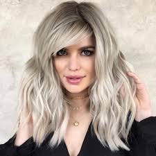 Layered haircuts for wavy hair with bangs. 25 Latest Medium Length Hairstyles With Bangs For 2021