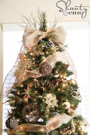 To make your first loop, unravel about 12 inches of ribbon from your roll, and create a. Easy Diy Tree Topper Shanty 2 Chic