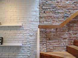 The interior designer picked dark blue glaze for the exposed brick wall in a bedroom where other room walls are painted either white or peach. Revealing The Pros And Cons Of Exposed Brick And How To Take Care Of It Dwell