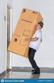 The Postman Carries A Big Package With Refrigerator. Stock Image - Image of  funny, home: 140217711