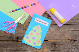 It's also a great way to make someone's day! Making A Christmas Greeting Card Step Paper Christmas Greeting Card Pencil Glue Stick Colored Paper Sheets Scissors On Wooden Table Easy Children Christmas Gift Idea Top View Stock Photo Picture And Royalty