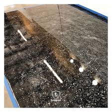 Black Base With Silver Titanium Highlights And A Cool Dispersing Effect Using Spray Paint For This Flo Metallic Epoxy Floor Epoxy Floor Coating Floor Coating