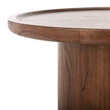 Round side tables sport stunning craftsmanship, perfect for adding style and function to any space around the house or office. Safavieh Devin Round Walnut Finish Pedestal Coffee Table 27 99 In Diameter Cof6600b Rona