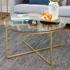 Its bent design features waterfall style legs for a striking structure that will steal the show in your. Clay Alder Home Toston 36 Inch Coffee Brown Table With X Base Glass Coffee Table Gold Coffee Table Round Coffee Table