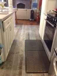 Porcelain Tile That Looks Like Aged Barn Wood Available At Lowe 39 S We Love It In Our Kitchen Called Natural Timber Ash Home Flooring Kitchen Flooring