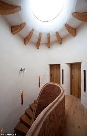 It is the same act of protection that drives the design on this sloping, north facing site. Grand Designs Cob House Episode
