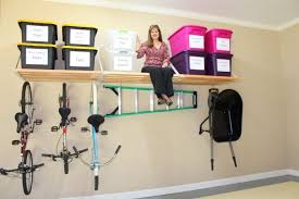 If you have more space for a workbench, try this one. Diy Overhead Garage Storage Shelf For Containers And Vertical Wall Mounted Bike Rack Diy Overhead Garage Storage Diy Storage Garage Storage Shelves