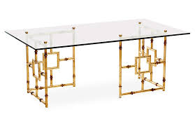 Each piece features a formal yet simple silhouette, with a golden base and heightened weather wood surface. Bamboo Float Glass Coffee Table Gold One Kings Lane