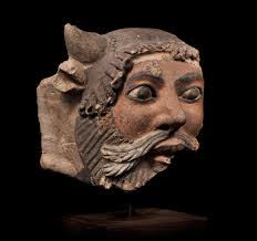 Bonhams : A large Etruscan polychrome terracotta head of Acheloos