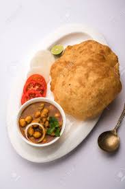 Maybe you would like to learn more about one of these? Chole Bhature Or Chick Pea Curry And Fried Puri Served In Terracotta Crockery Over White Background Selective Focus Stock Photo Picture And Royalty Free Image Image 102977565