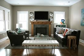 In a living room with the tv located on top of the fireplace, people usually spend hours sitting if the room is rectangular, don't use a square rug. Living Room Layout Ideas