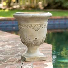 A chair, instruments, an old bike, or the heavy white flowers along the side of this patio and the moss growing between the stones of the pathway add a softness to the stellar outdoor area. Antique Stone Urn Planter You Will Have The Versatility For Indoor Or Outdor Use While Still Maintaining The C Stone Planters Urn Planters Flower Pots Outdoor