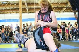 I love the look of surrender on his face. What Female Wrestlers Wear To Battle Sexism Racked