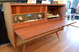 Cabinet doors can be used for more than just hiding stacks of dishes in your kitchen cabinets. Diy Repurposing An Old Stereo Console
