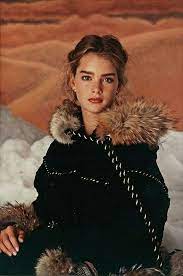 Mommy penguins snuggle close to her baby to shield him away from the antarctic cold. Pin On Brooke Shields The 80s Look
