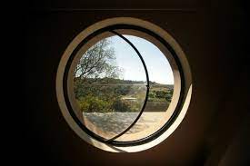 Small round window in architecture. Wright House By Elmo Swart Wright House Thatch Cottage Round Window Design