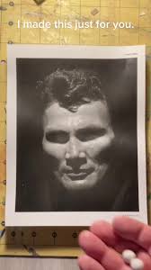 Playing with a photo of actor Jack Palance.