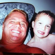 Classic photo of WWE Hall of Fame legend "Mr. Perfect" Curt Hennig and his  youngest son Hank Hennig at their home in Minnesota. His oldest son is WWE  Superstar Curtis Axel (Joe