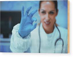 Researcher Holding An Rfid Implant Chip Wood Print