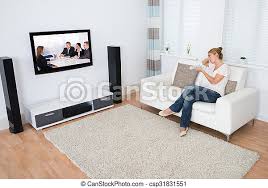 Tv sofa wallpapers and backgrounds available for download for free. Woman Watching Tv While Sitting On Sofa Full Length Of Young Woman Watching Tv While Sitting On Sofa In Living Room Canstock
