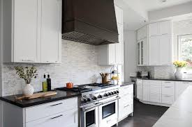 $21.11 ($2.11 per item) 177. Black Kitchen Hood With Thin Marble Stacked Backsplash Tiles Transitional Kitchen