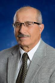 Erica Bell, executive director of Regional Centers and Online Programs, and  Dr. Wes Totten, chair for the Department of Agriculture, Geoscience and  Natural Resources, recently presented with Dr. Stephen Milligan (president  of