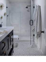 The sinks have soft, accent lighting while the opposite area with marble countertops boasts lantern lights. 20 Bathroom Floors That Make A Bold Statement
