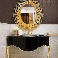 Black And Gold Art Deco Interior Black And Gold Powder Room With Gold Oval Sunburst Mirror Bathroom Wall Decor Boutique Bathroom Art Deco Interior